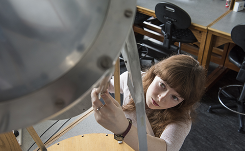 Female student in physics laboratory